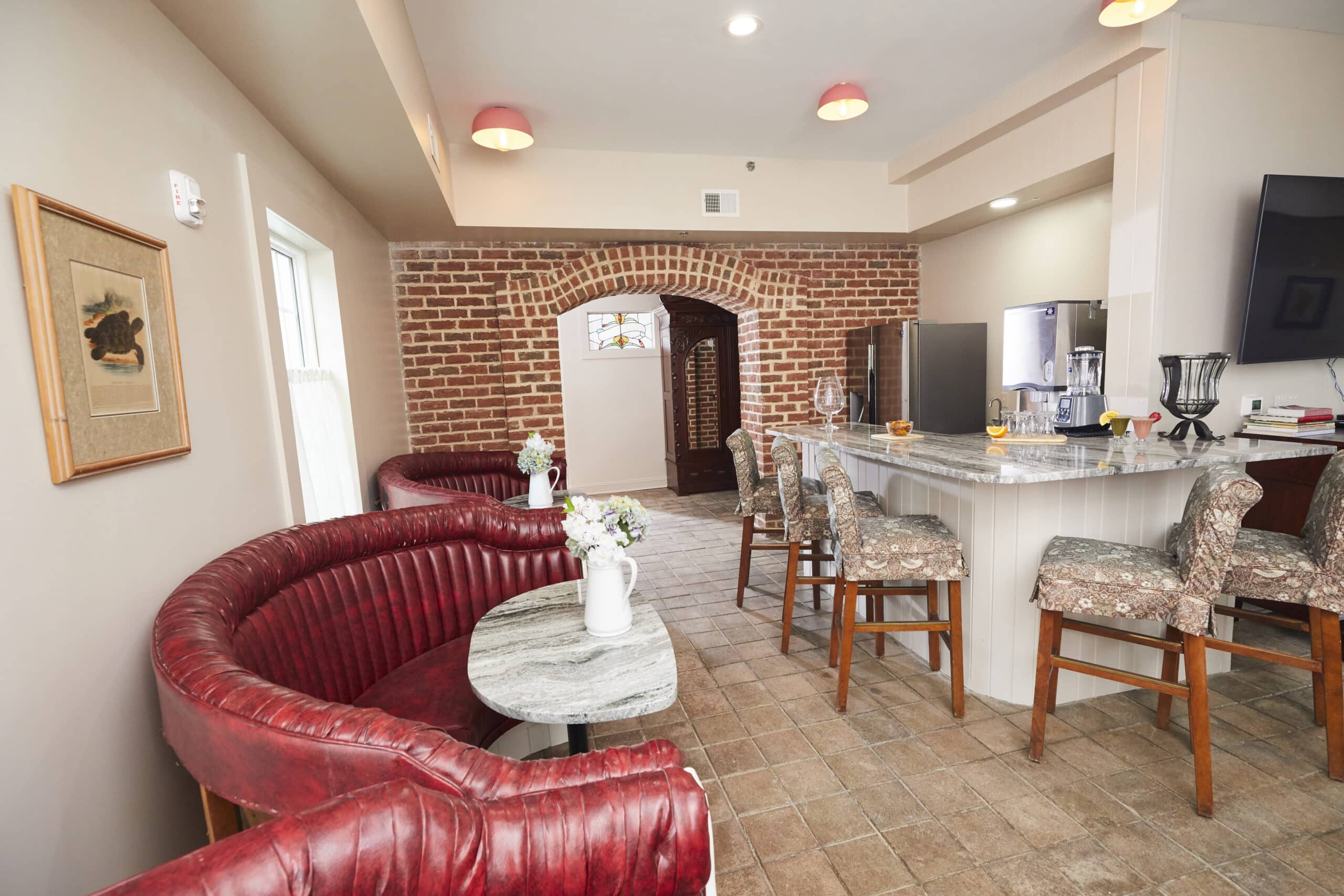 Lounge with seating beside kitchen and breakfast bar