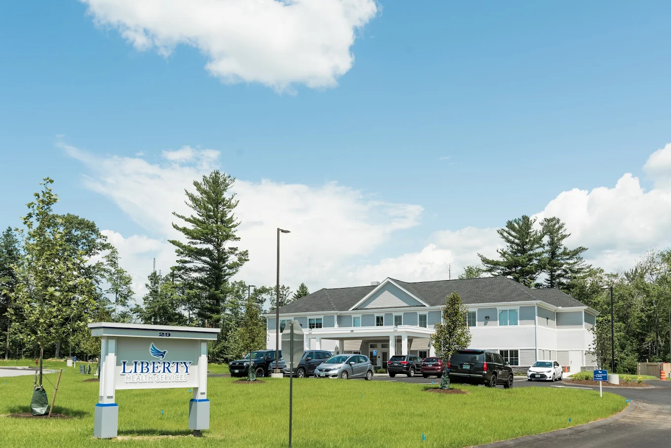 White rehab facility with Liberty Health Services sign out front
