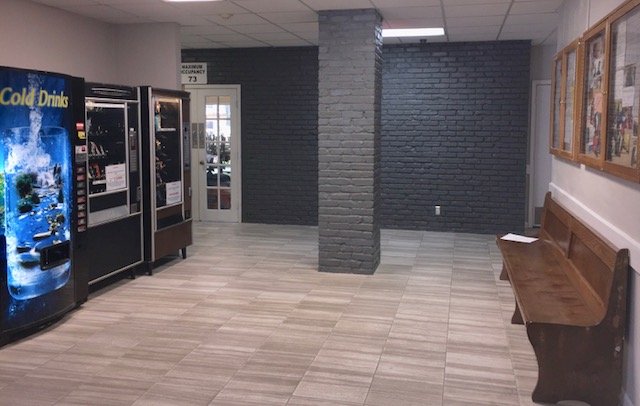 Vending machines and bench in common hallway
