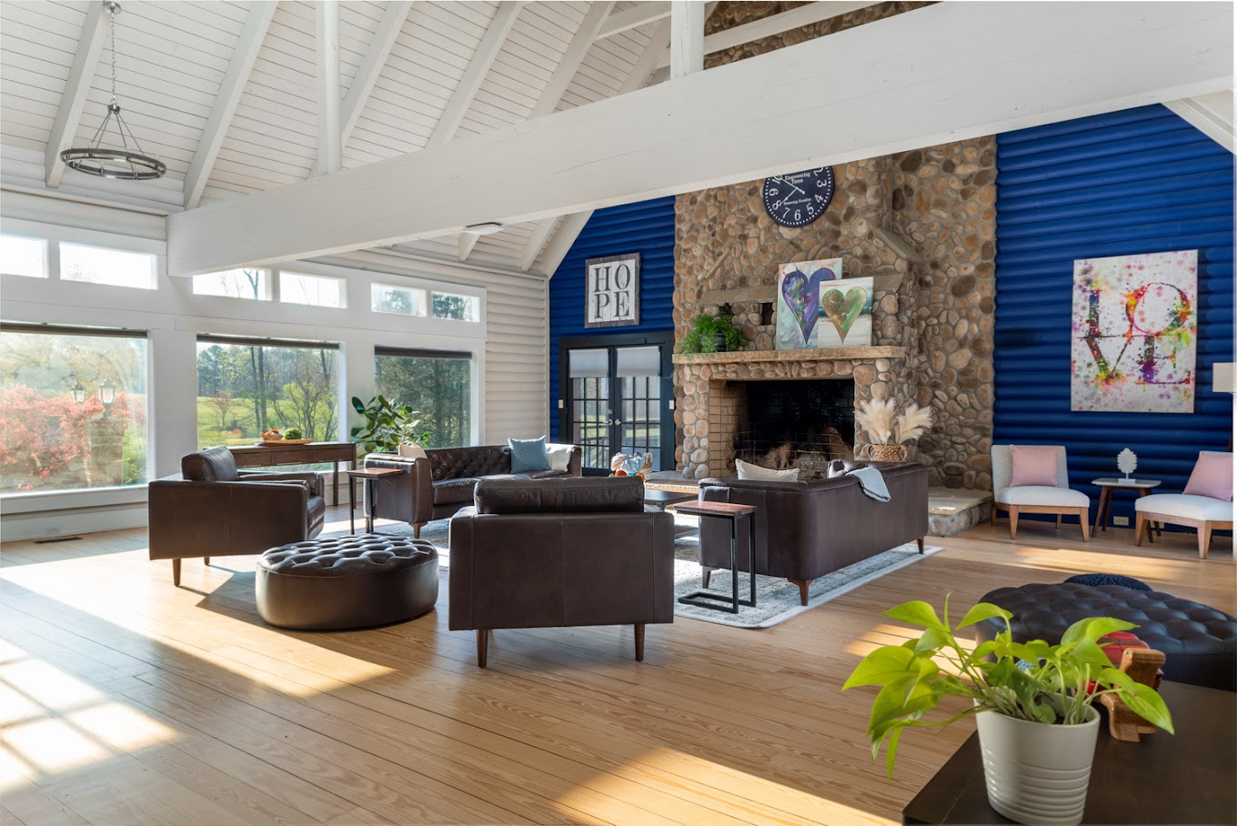 Lounge with seating and a fireplace.