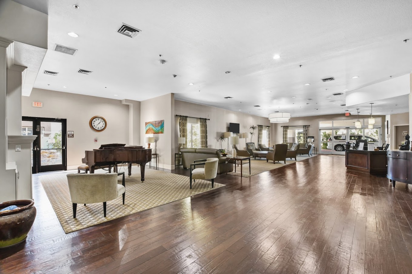Spacious lobby with a grand piano and seating area