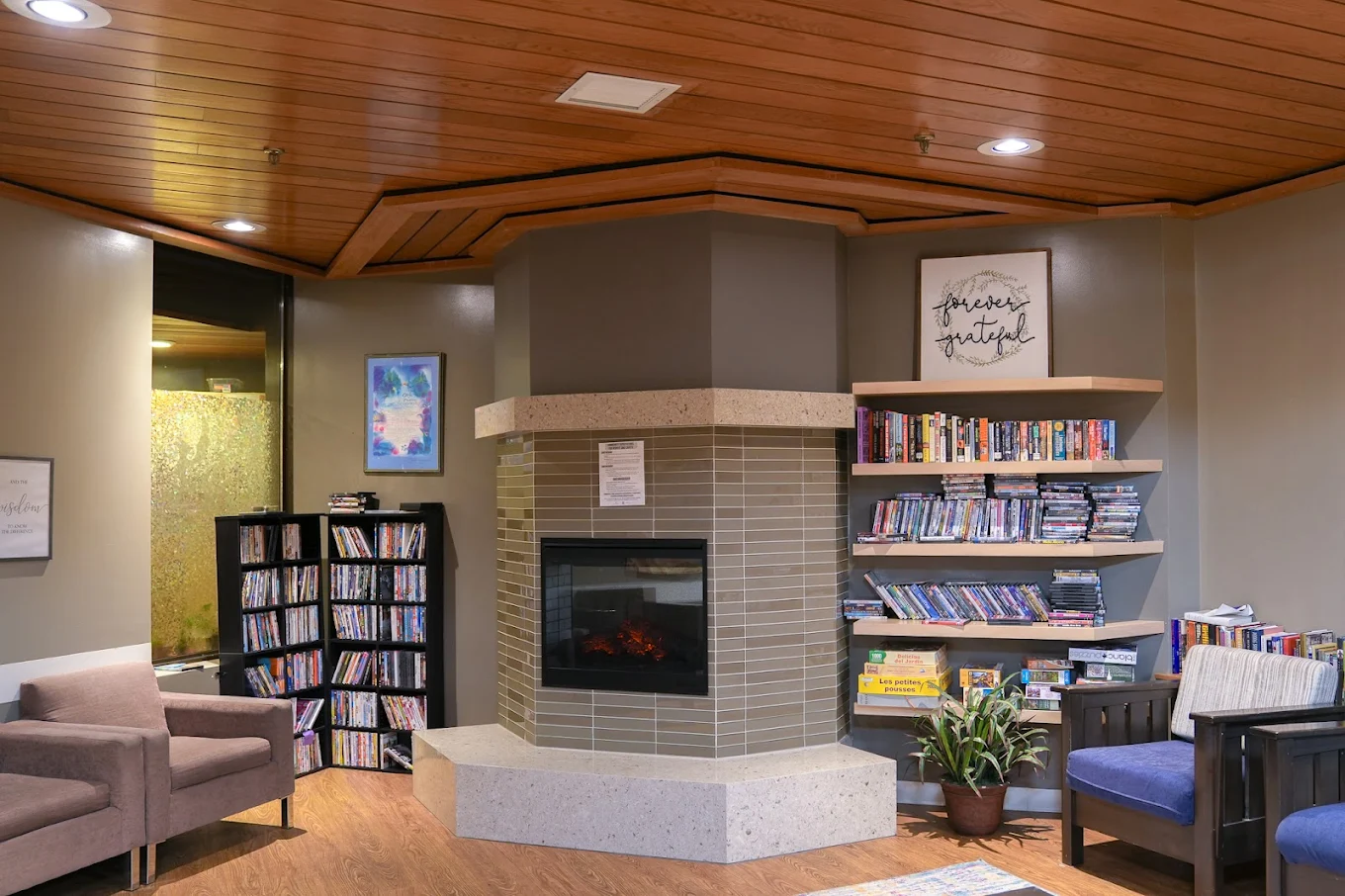 Lounge with bookshelves and seating at EOSIS Tapestry