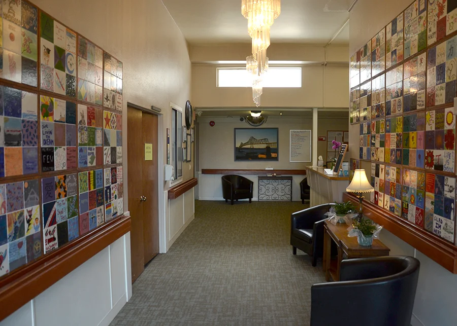 Reception hallway with art tiles and chandelier