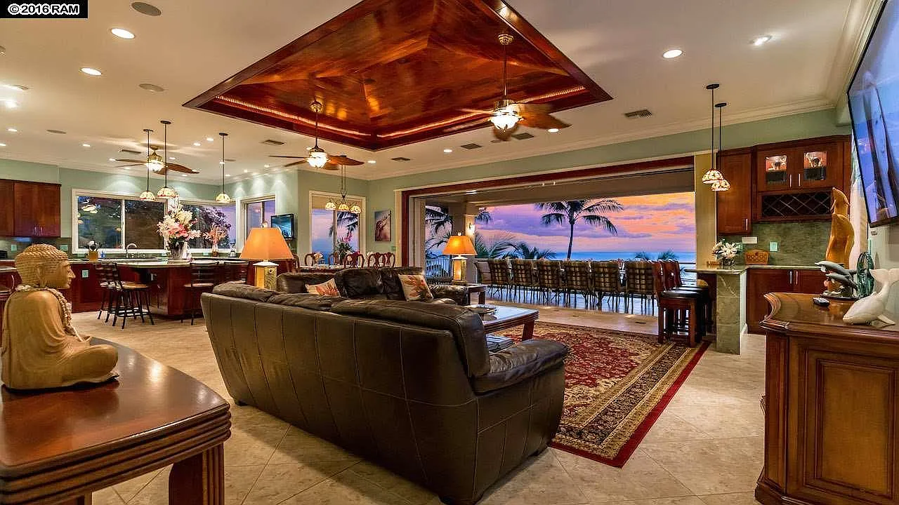 Spacious great room with gourmet kitchen, lounge seating, and ocean-view dining area