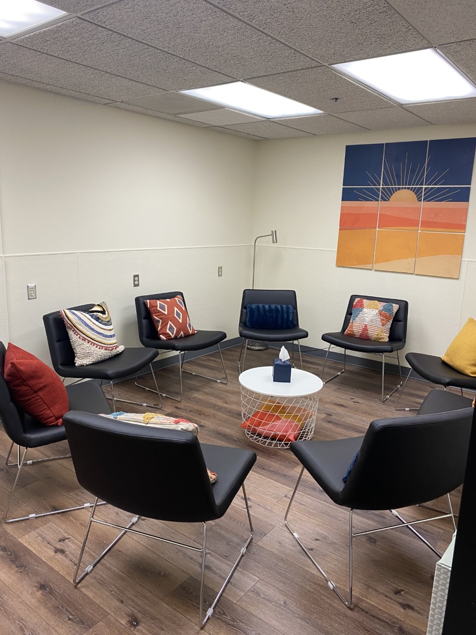 Small therapy room with chairs arranged in a circle