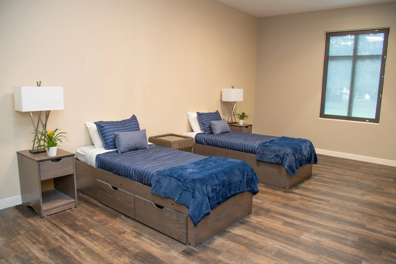 Shared bedroom with twin beds and nightstands