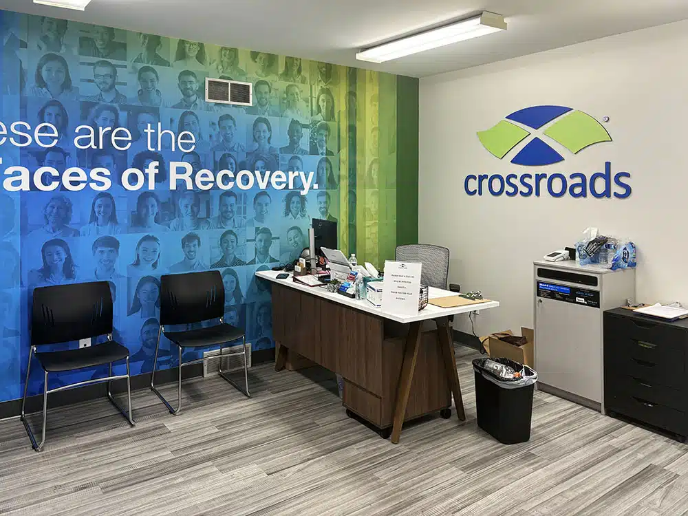 Intake office with desk and Crossroads logo wall mural