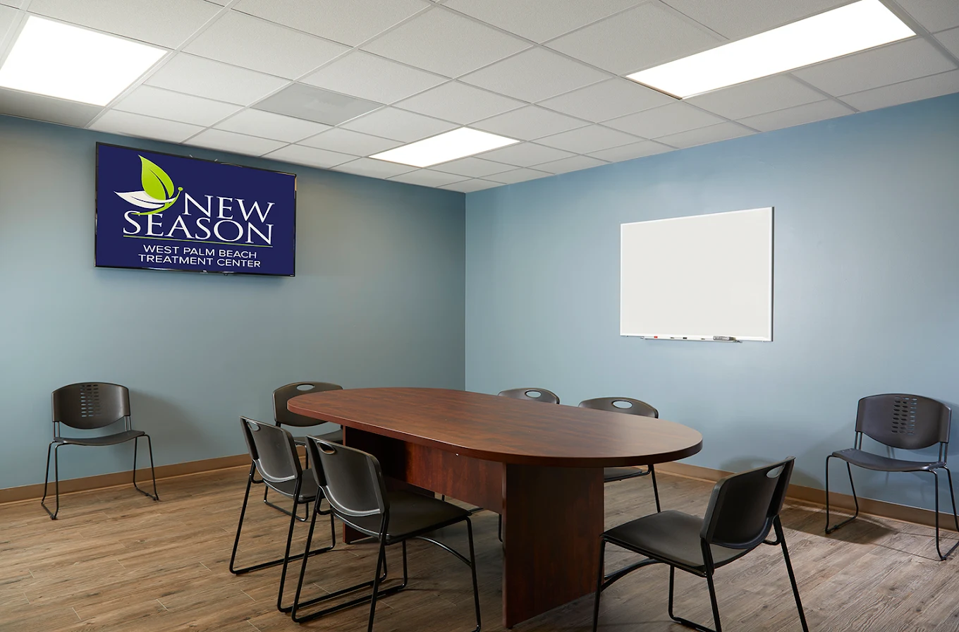 Group therapy room with table and chairs