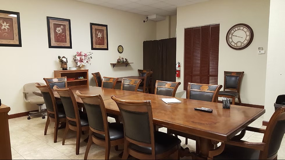 Oval table with black chairs in professional meeting room