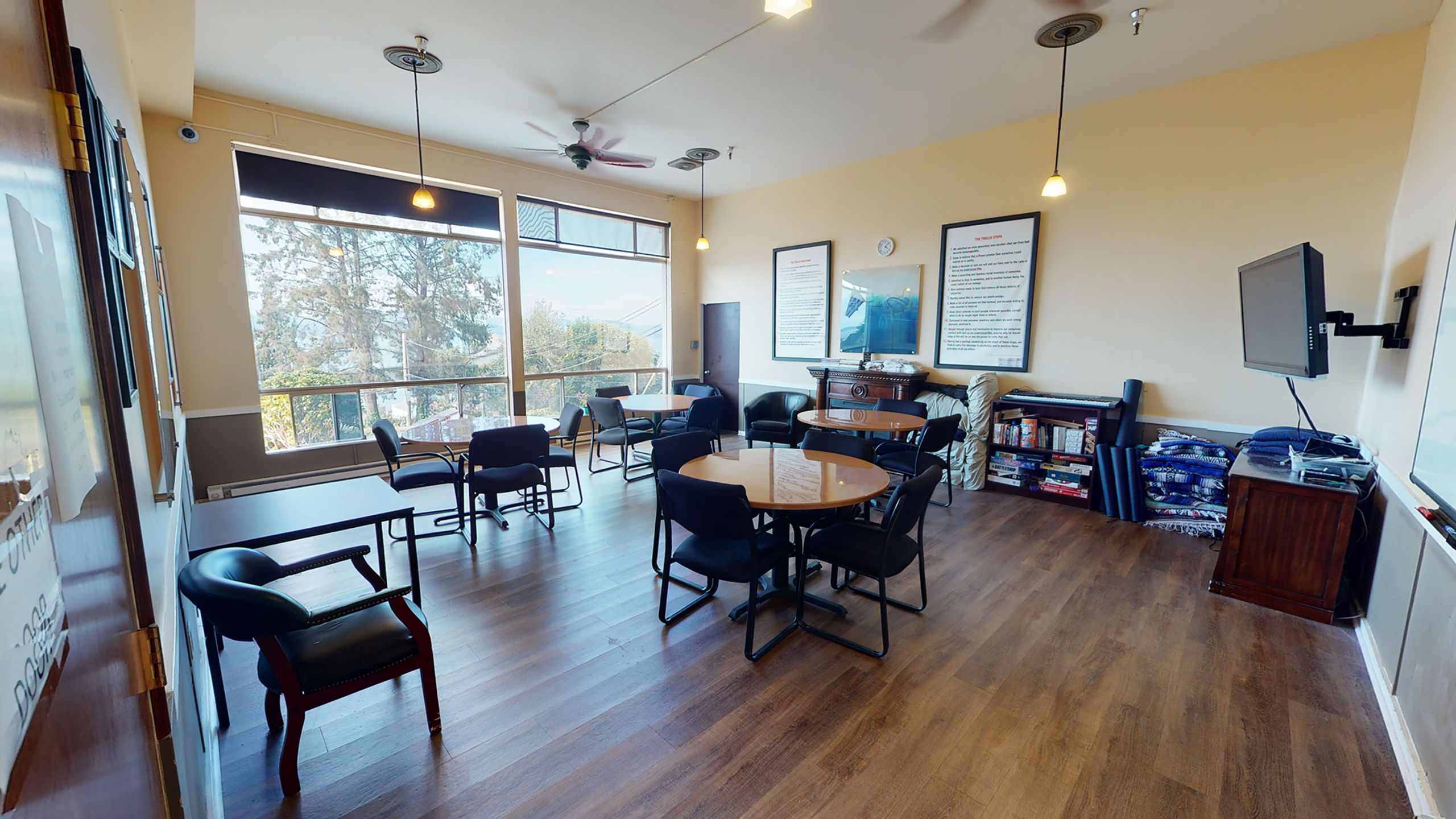 Meeting space with round tables and window view