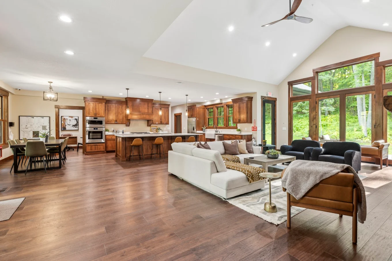 Open living room and kitchen with large windows