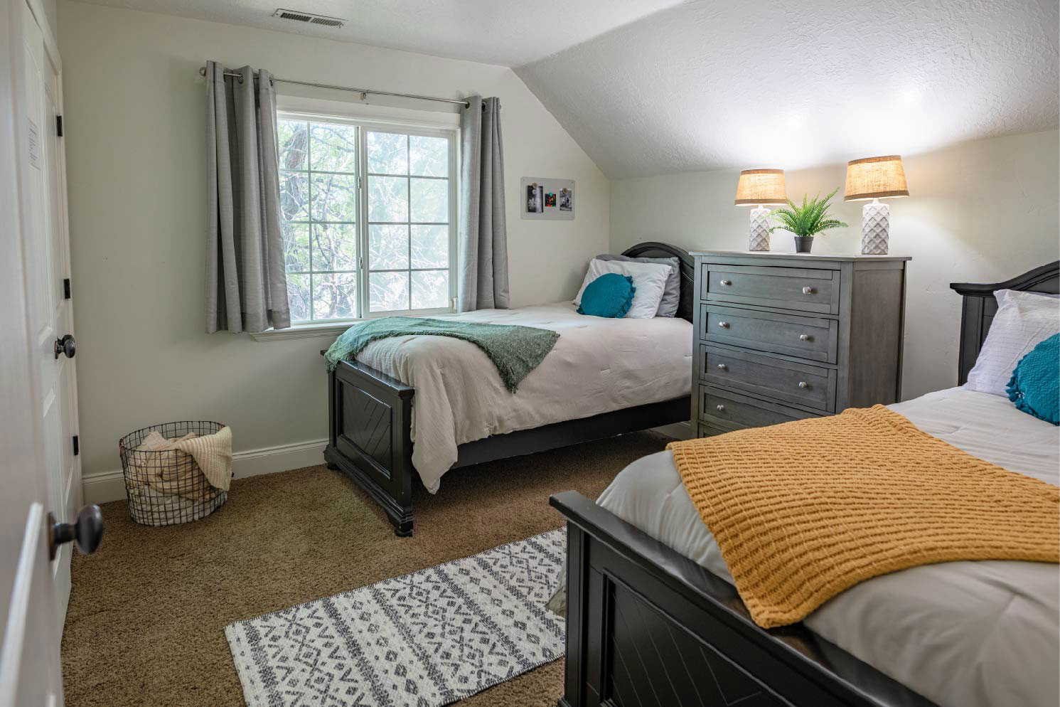 Cozy bedroom with gray furniture and warm lighting
