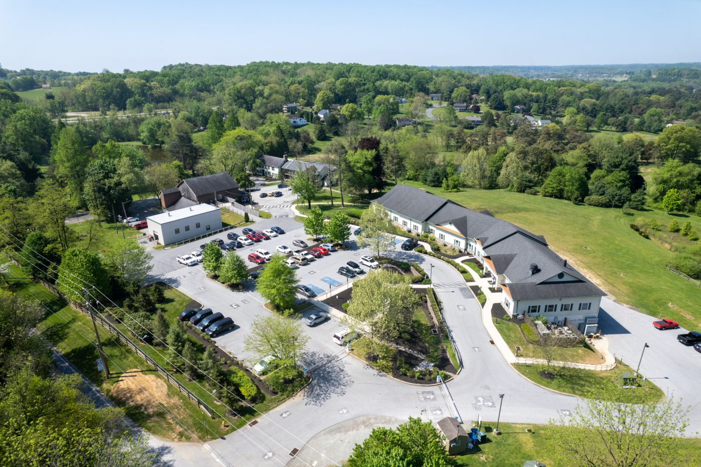 Aerial view of Bowling Green Brandywine treatment center campus surrounded by trees and open land