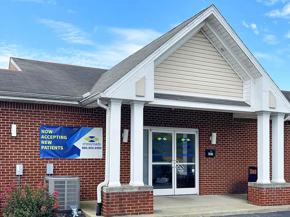 Brick clinic building with columns and main entrance doors