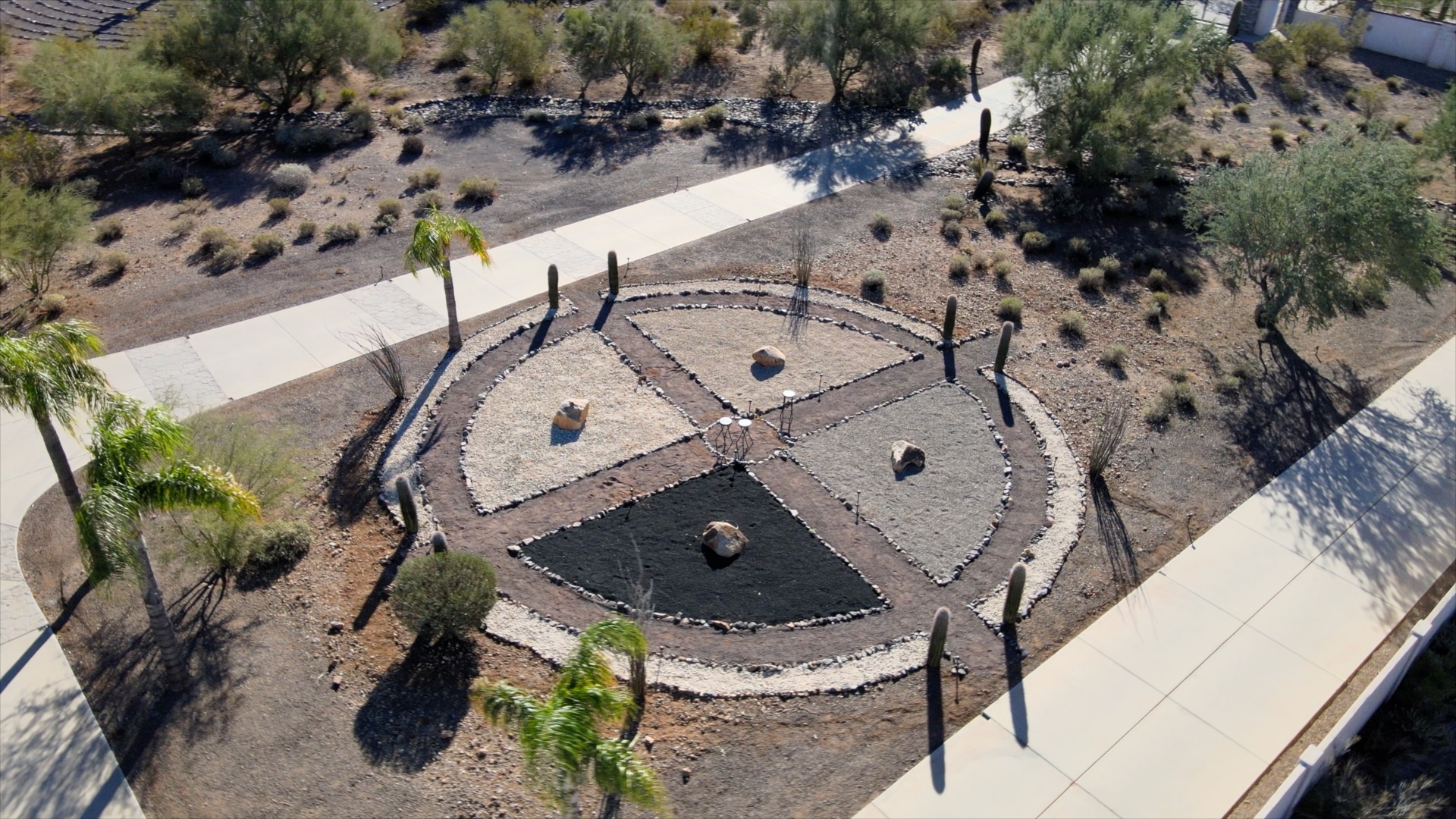 Circular stone meditation garden with cacti and desert plants