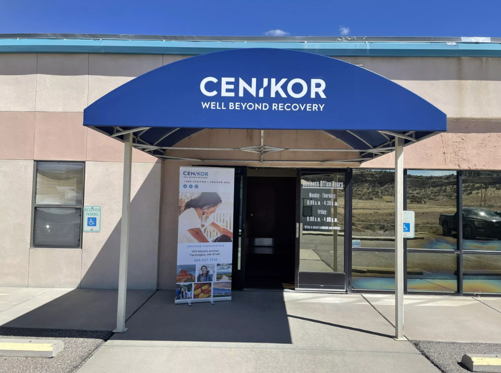 Blue awning entrance to Cenikor Well Beyond Recovery center