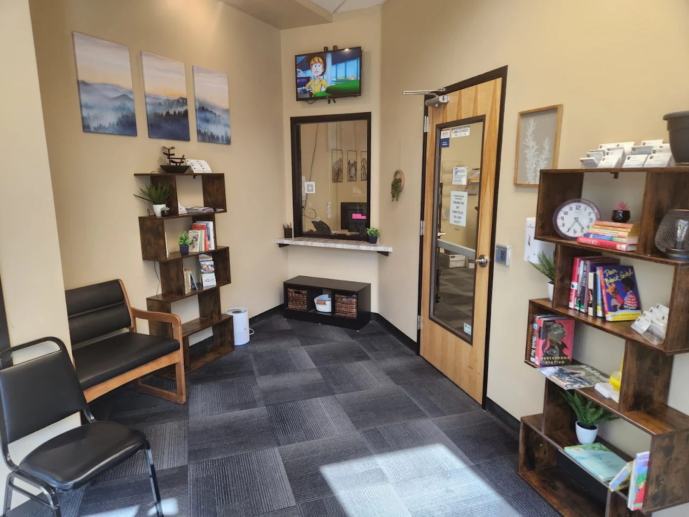 Small rehab reception with check-in window and bookshelves