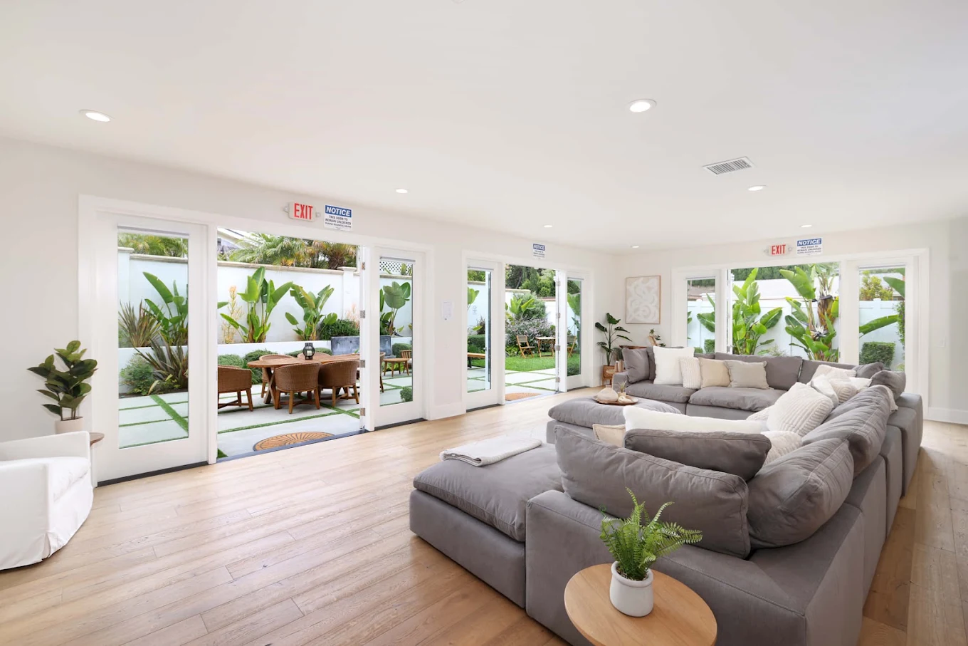 Bright living room with sectional sofa and large windows
