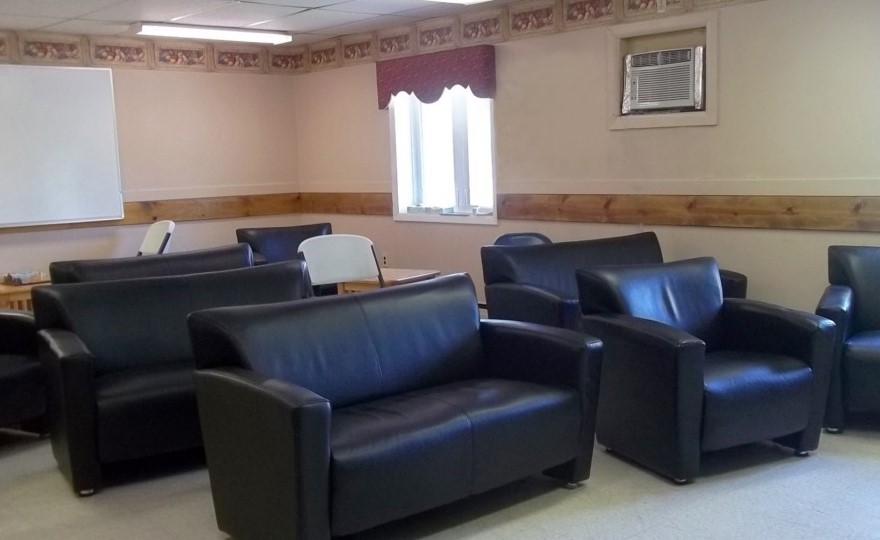 Black leather seating in cozy community space