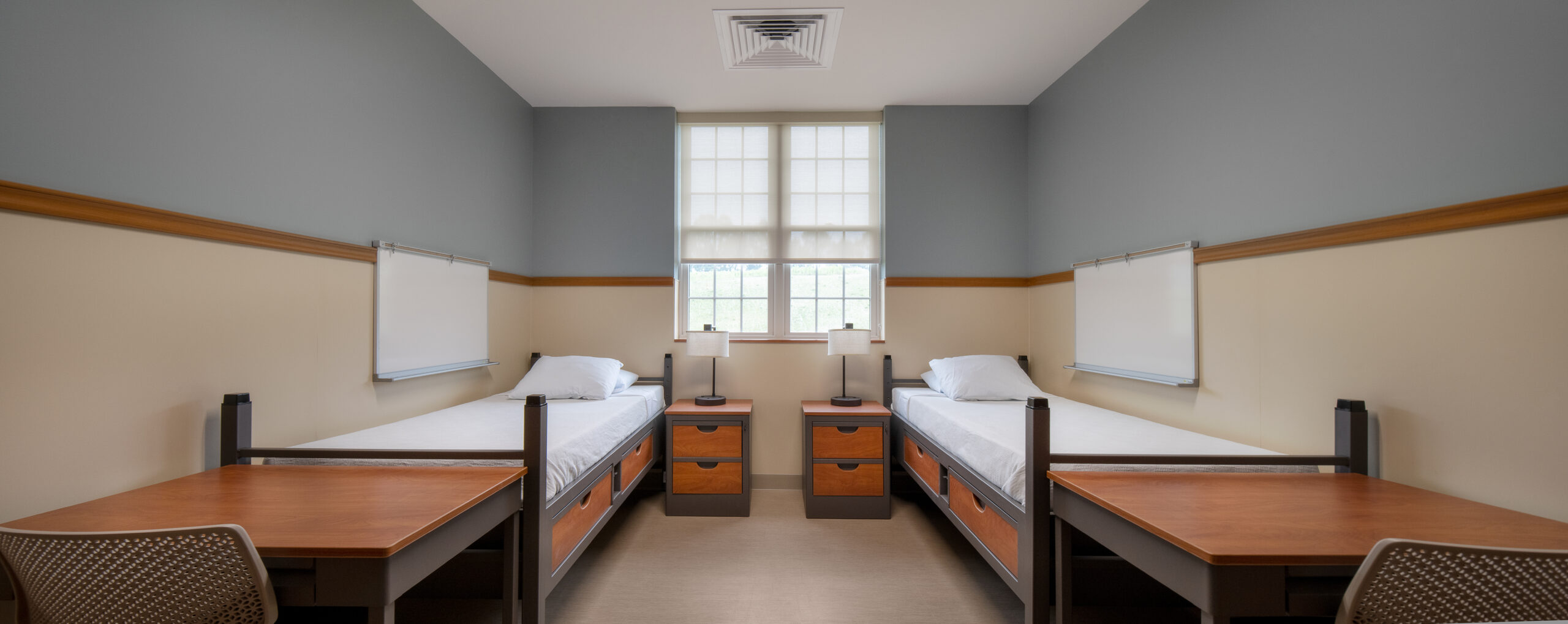 Shared bedroom with two beds at UPMC Twin Lakes residential treatment