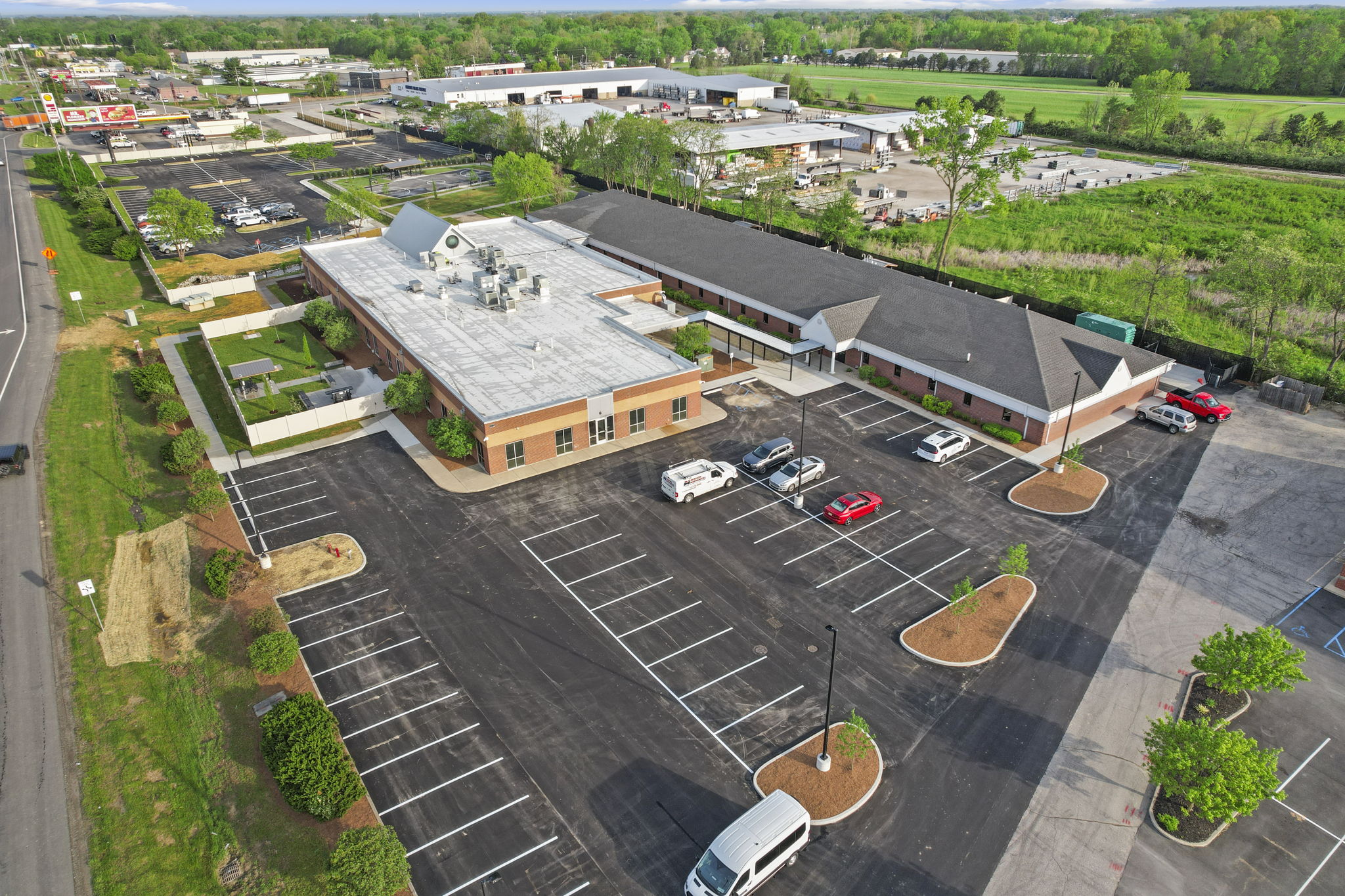 Aerial view of a large rehab facility with a parking lot.