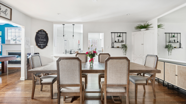 Dining room with large wooden table and chairs