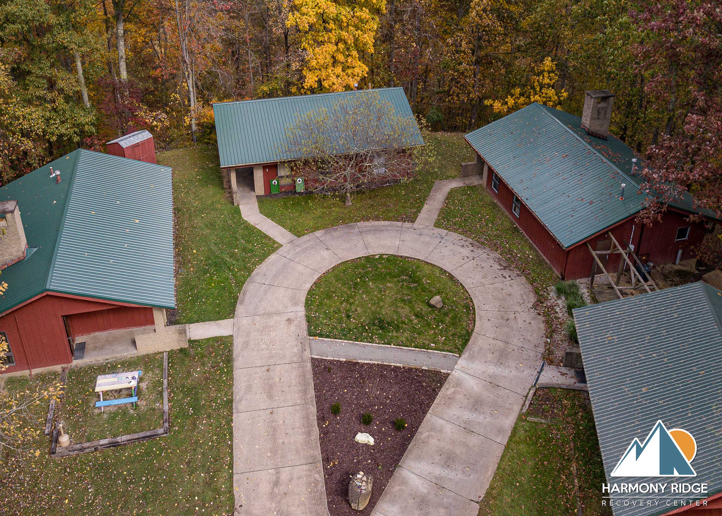 Aerial view of a large rehab center surrounded by a forest