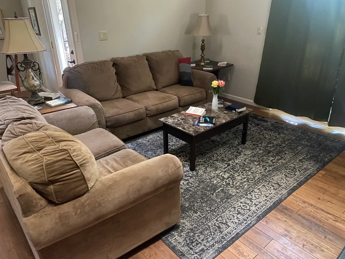 Dining table and cozy living room with natural light
