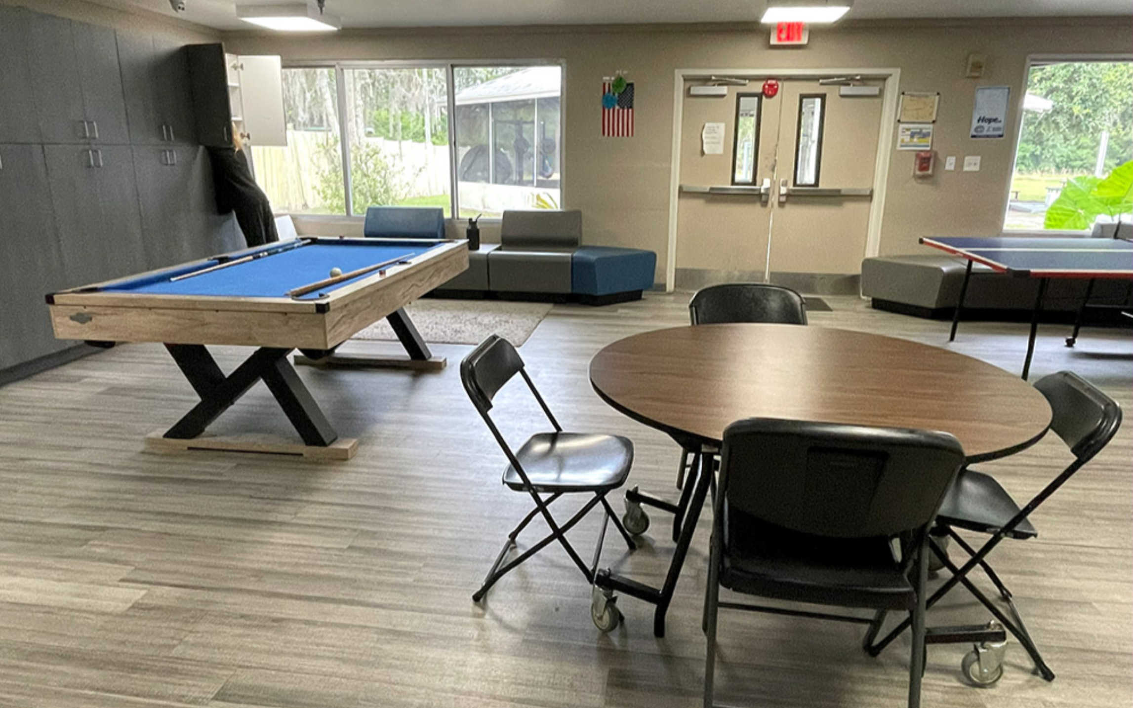 Recreation room with pool table, ping pong table, and seating