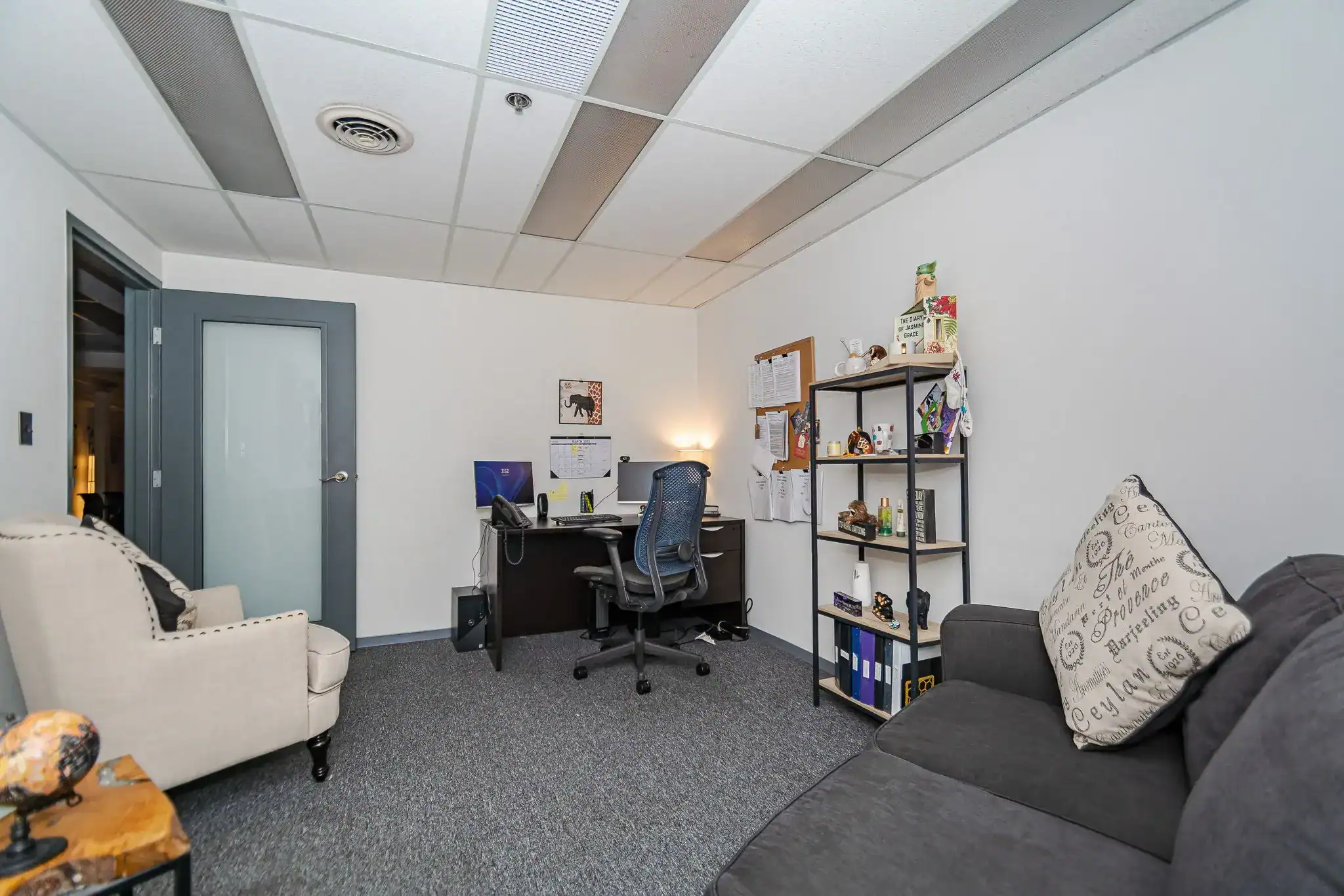 Private therapy office with desk and seating