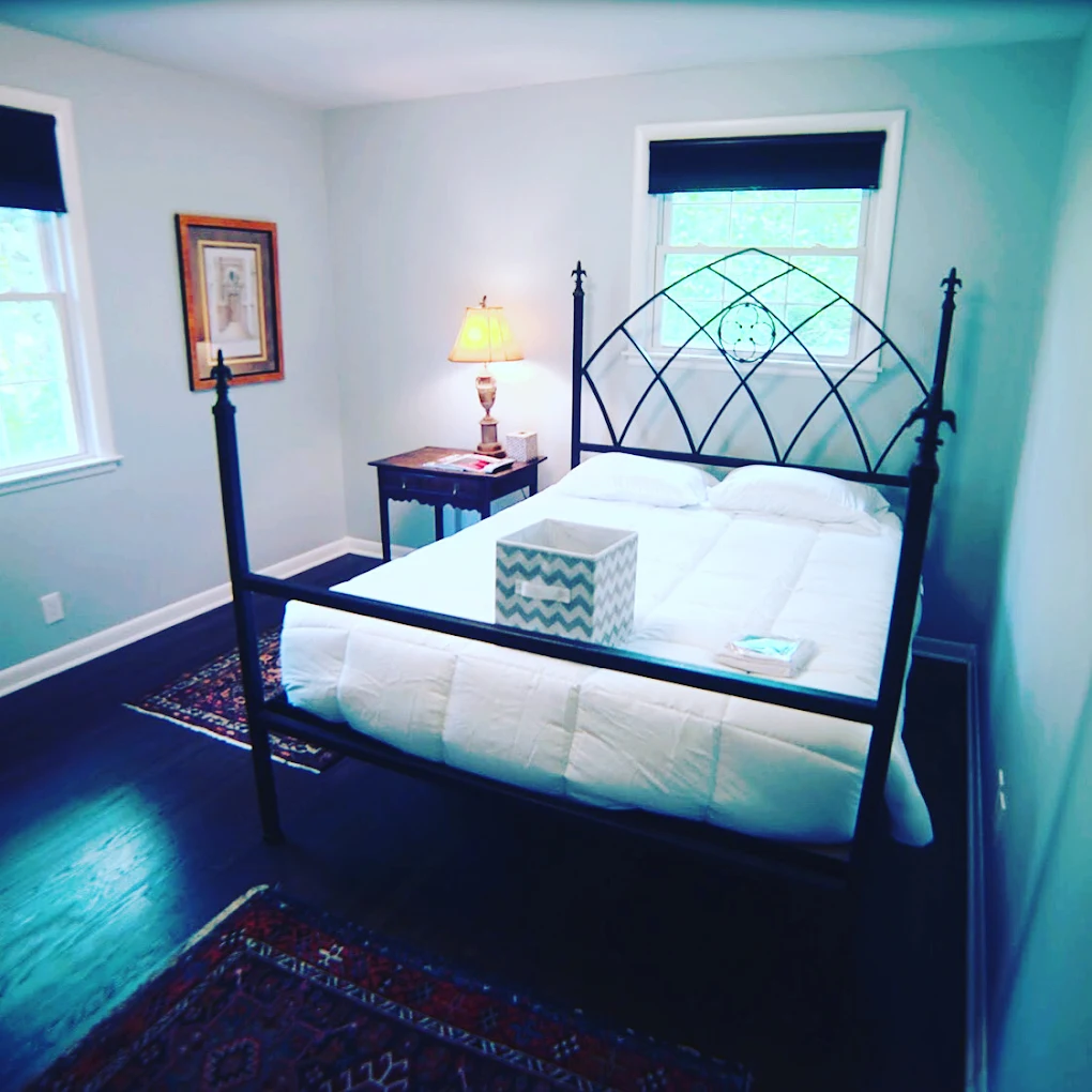 Private bedroom with queen bed and rug