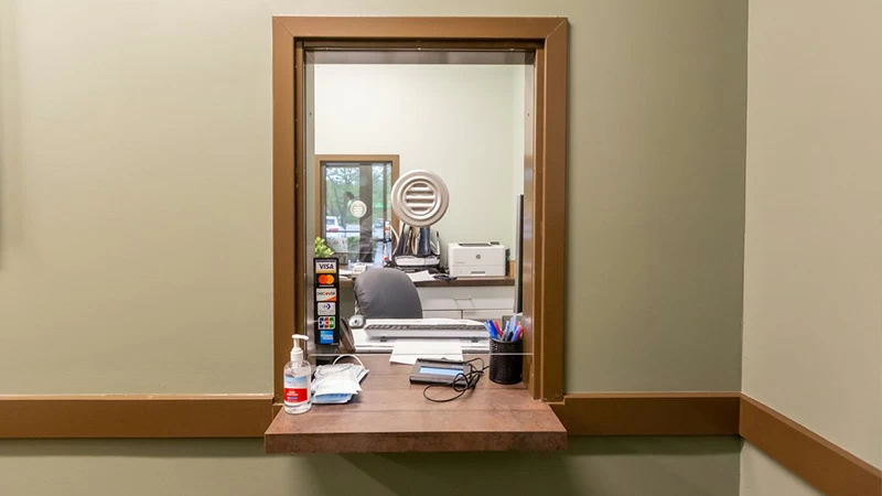 Reception office window inside rehab treatment center