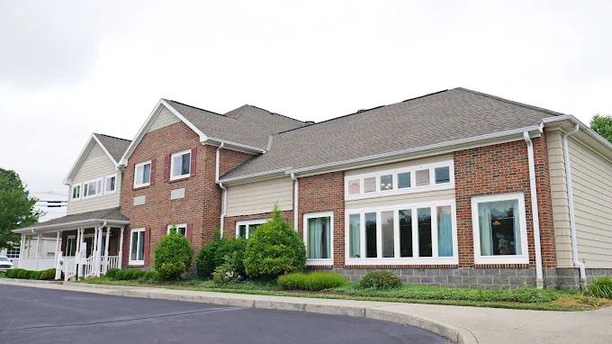 Large brick treatment center with landscaped front lawn
