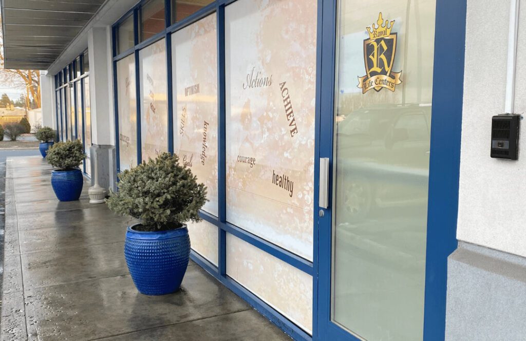 Entrance with blue trim and motivational words on glass