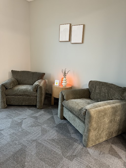 Private counseling space with two large chairs.