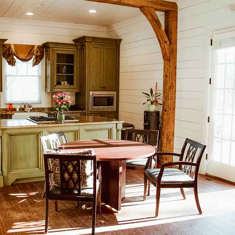 Rustic kitchen with cabinetry, countertops, and natural wood accents