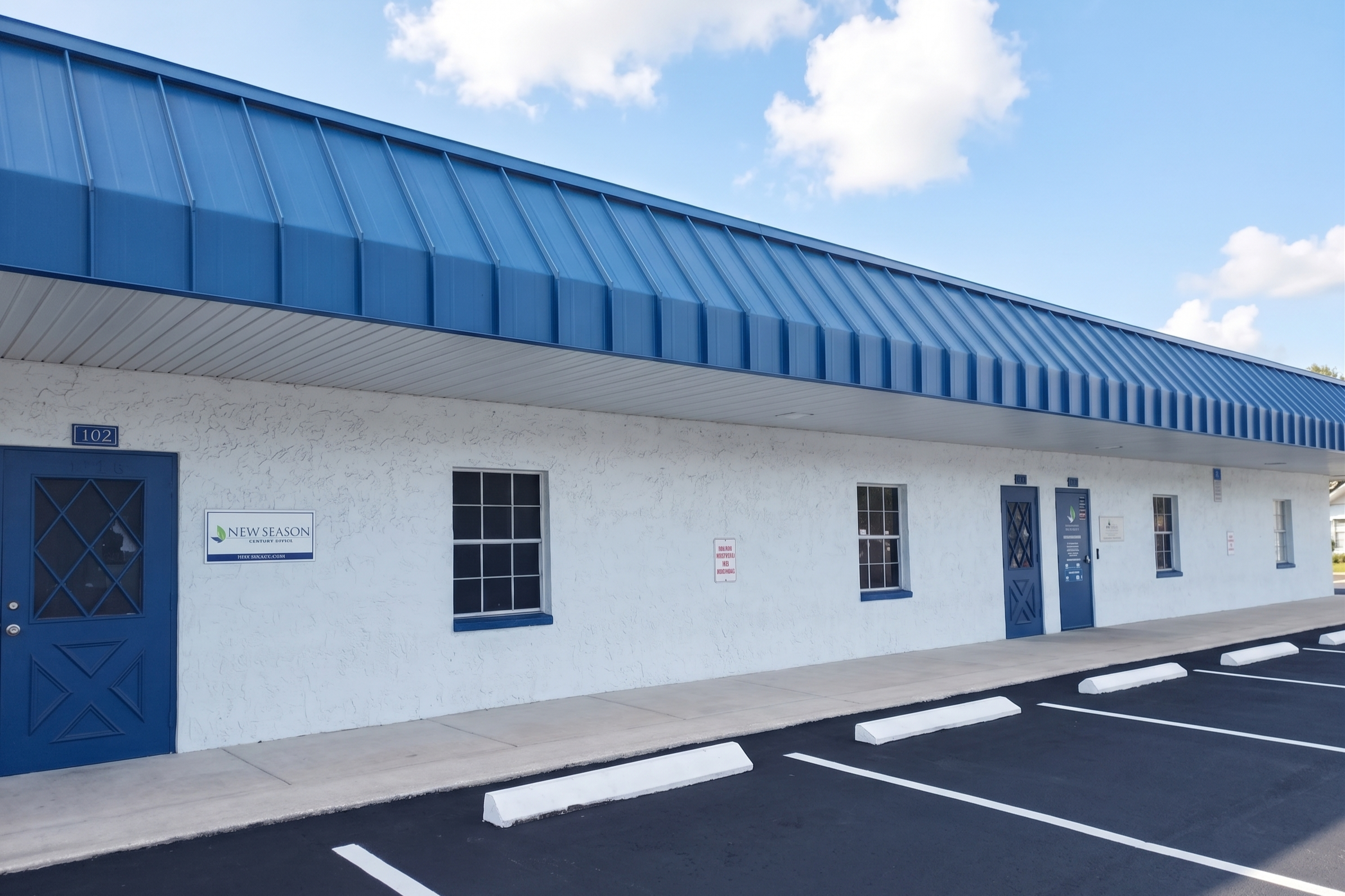 Blue-roofed building with New Season signage and parking
