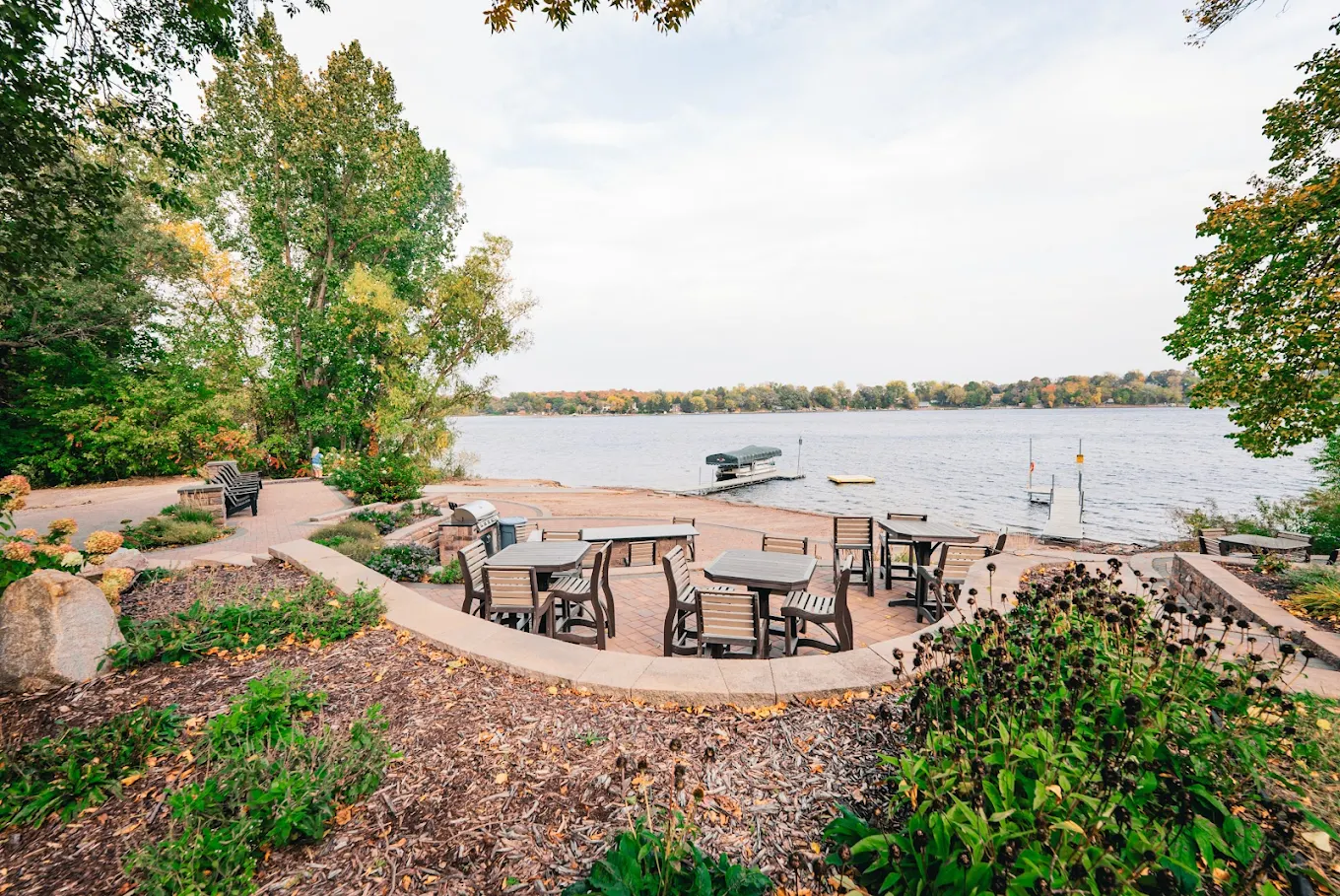 Lakeside patio with outdoor seating and private dock