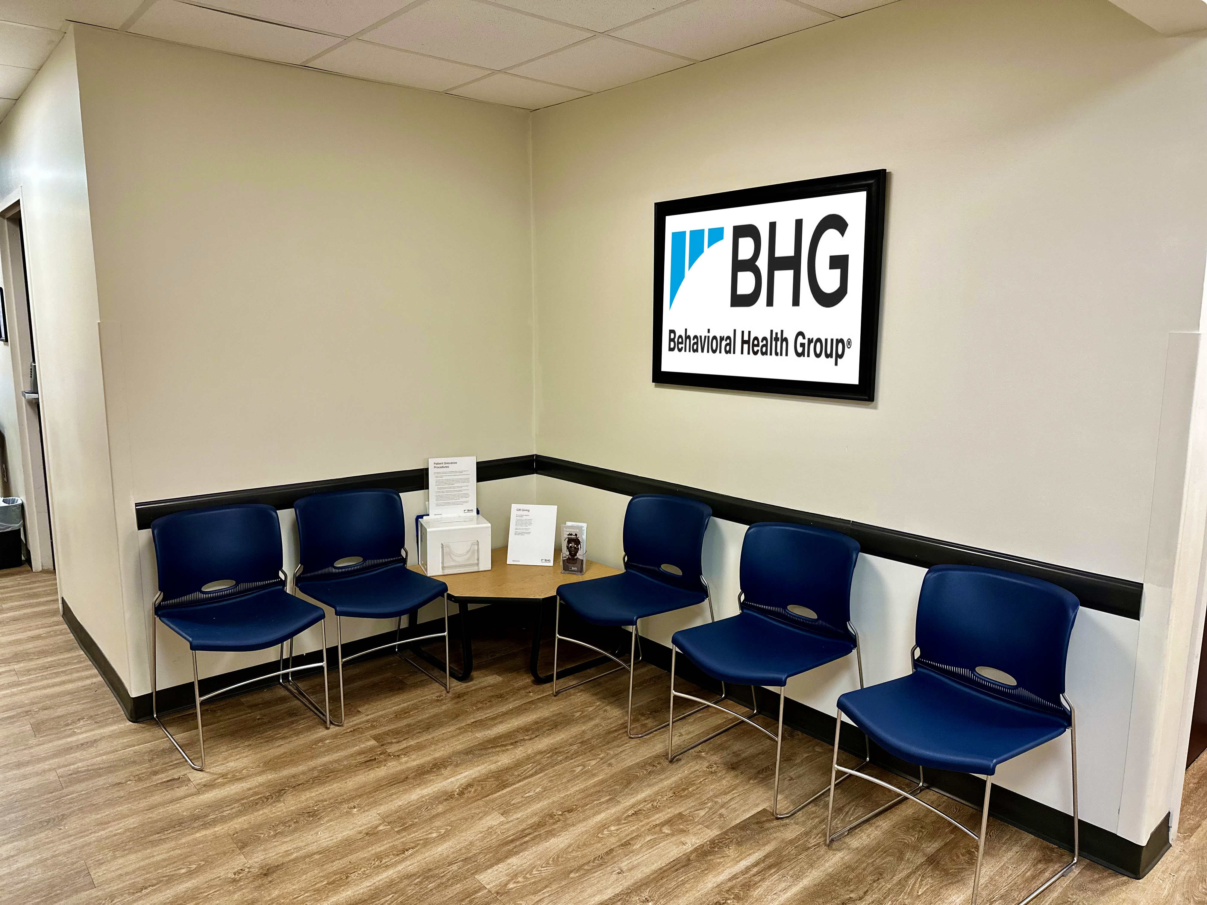 Waiting area with chairs and BHG wall sign