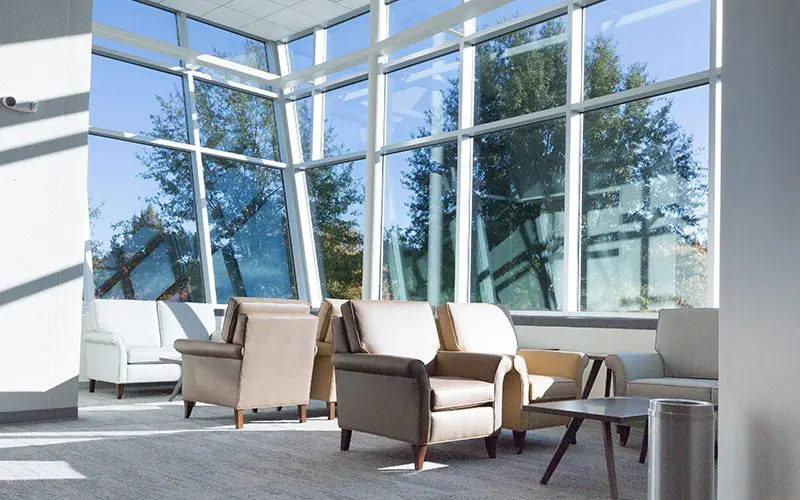 Spacious lobby with lounge seating and natural light
