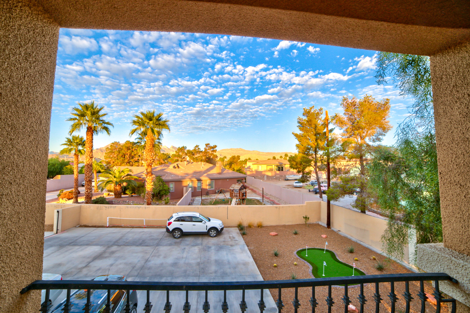 A scenic balcony view overlooking a suburban neighborhood.