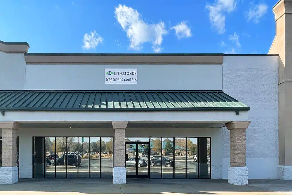 Front exterior with glass doors and Crossroads sign