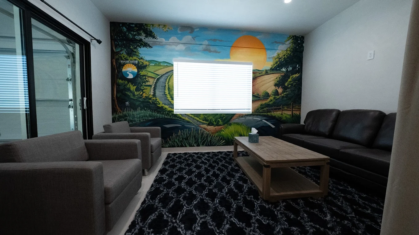 Office desk and seating area with wall-mounted TV