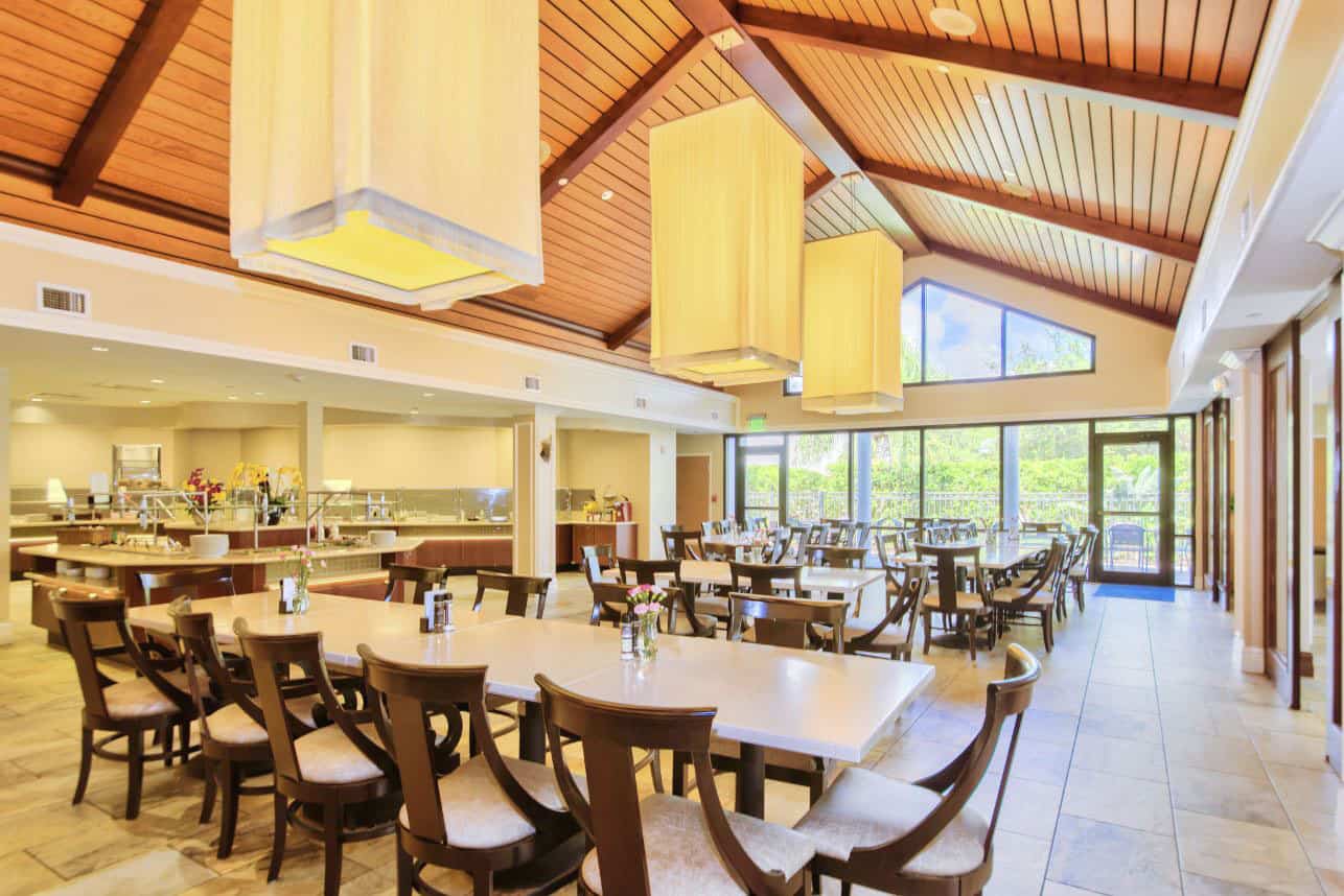 Dining hall with wood tables and high ceilings