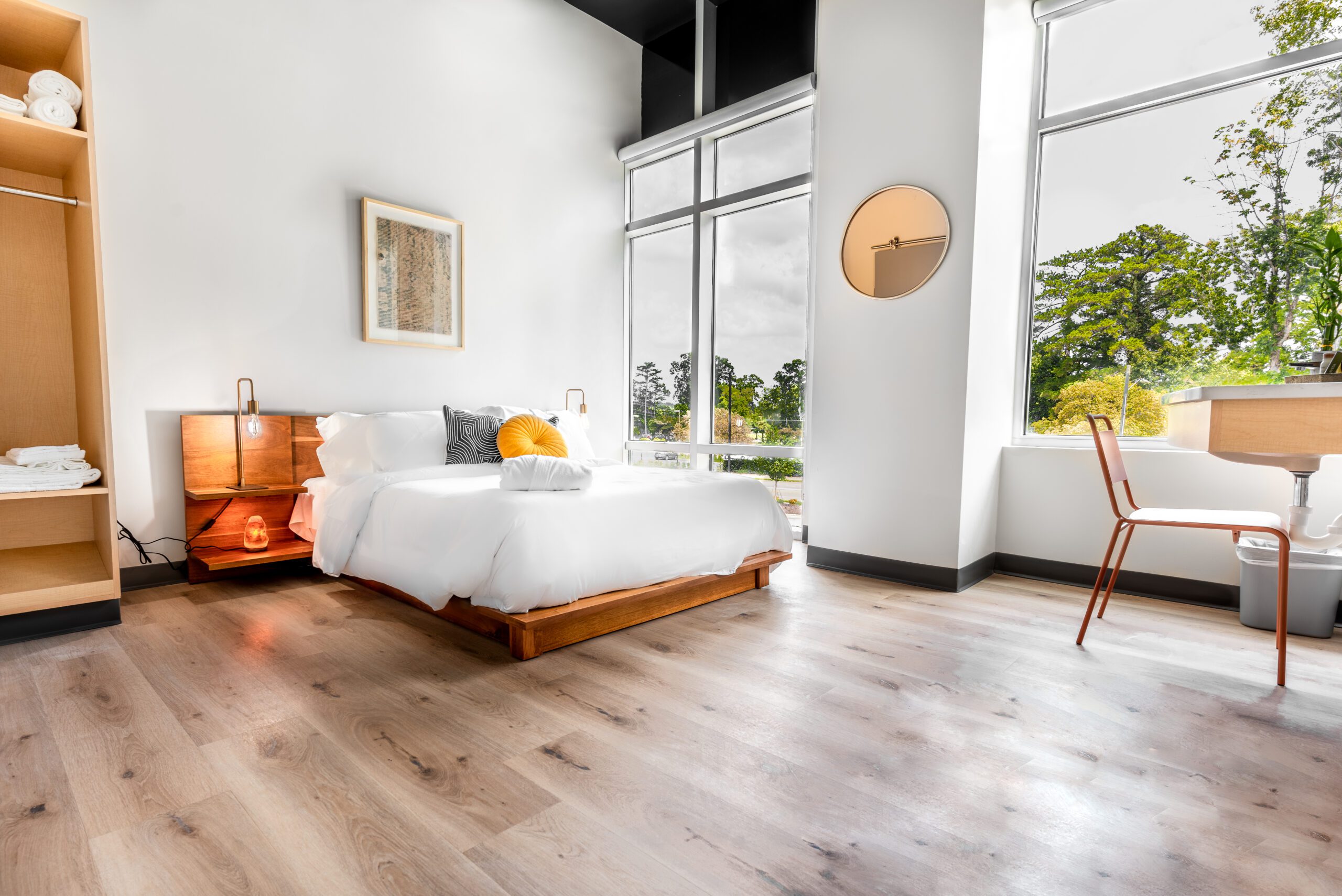 Private bedroom with queen bed and large windows