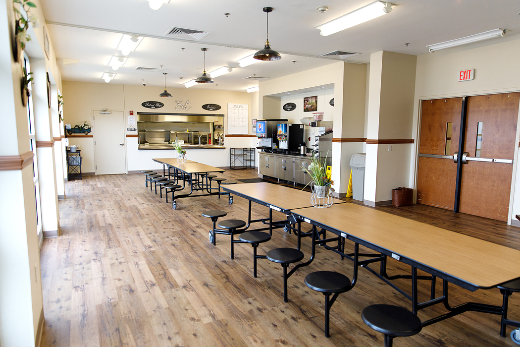Dining hall with long tables and cafeteria-style seating
