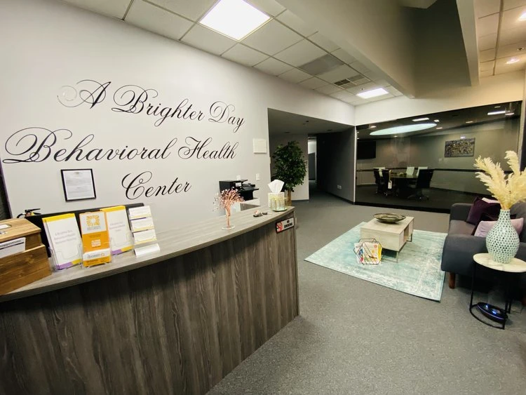 Front desk with brochures and wall signage