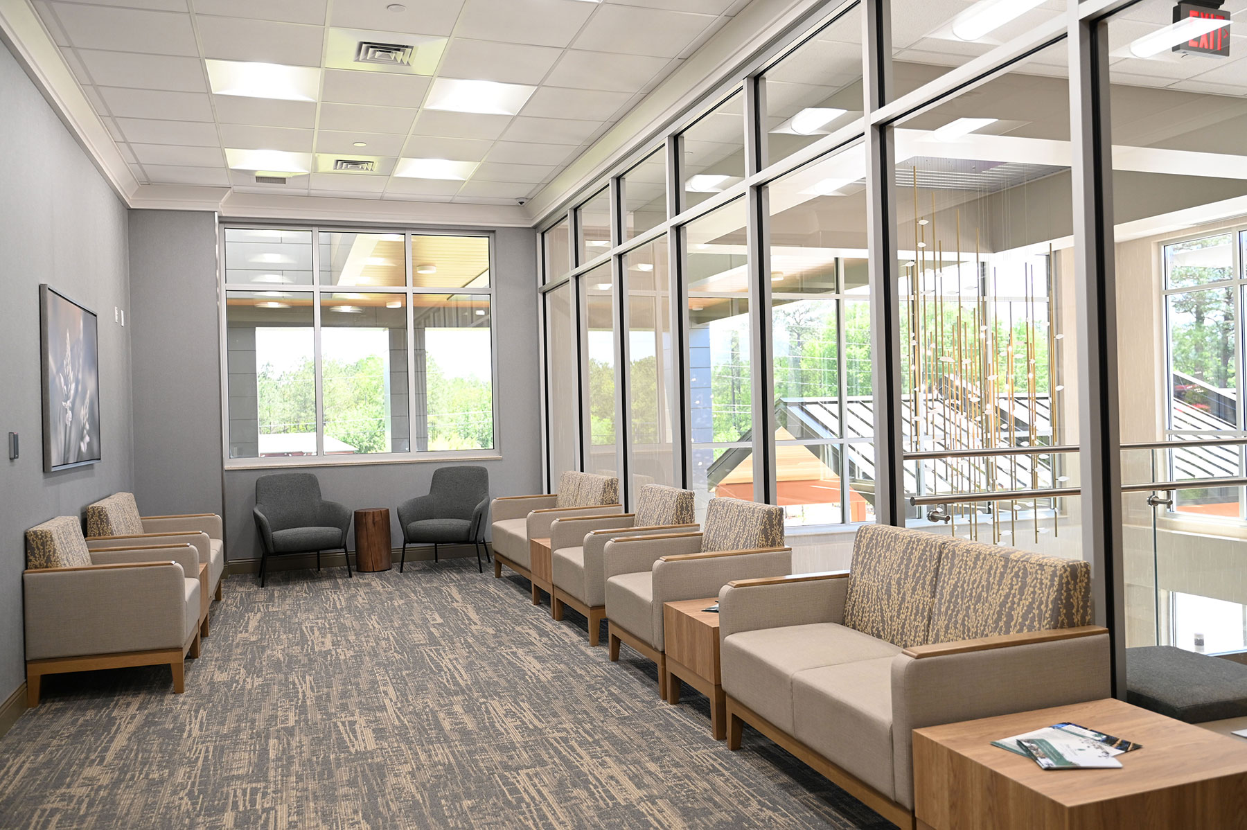 Bright lounge with cushioned seating and large windows