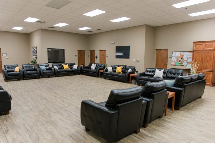 Large room with leather chairs arranged in a circle