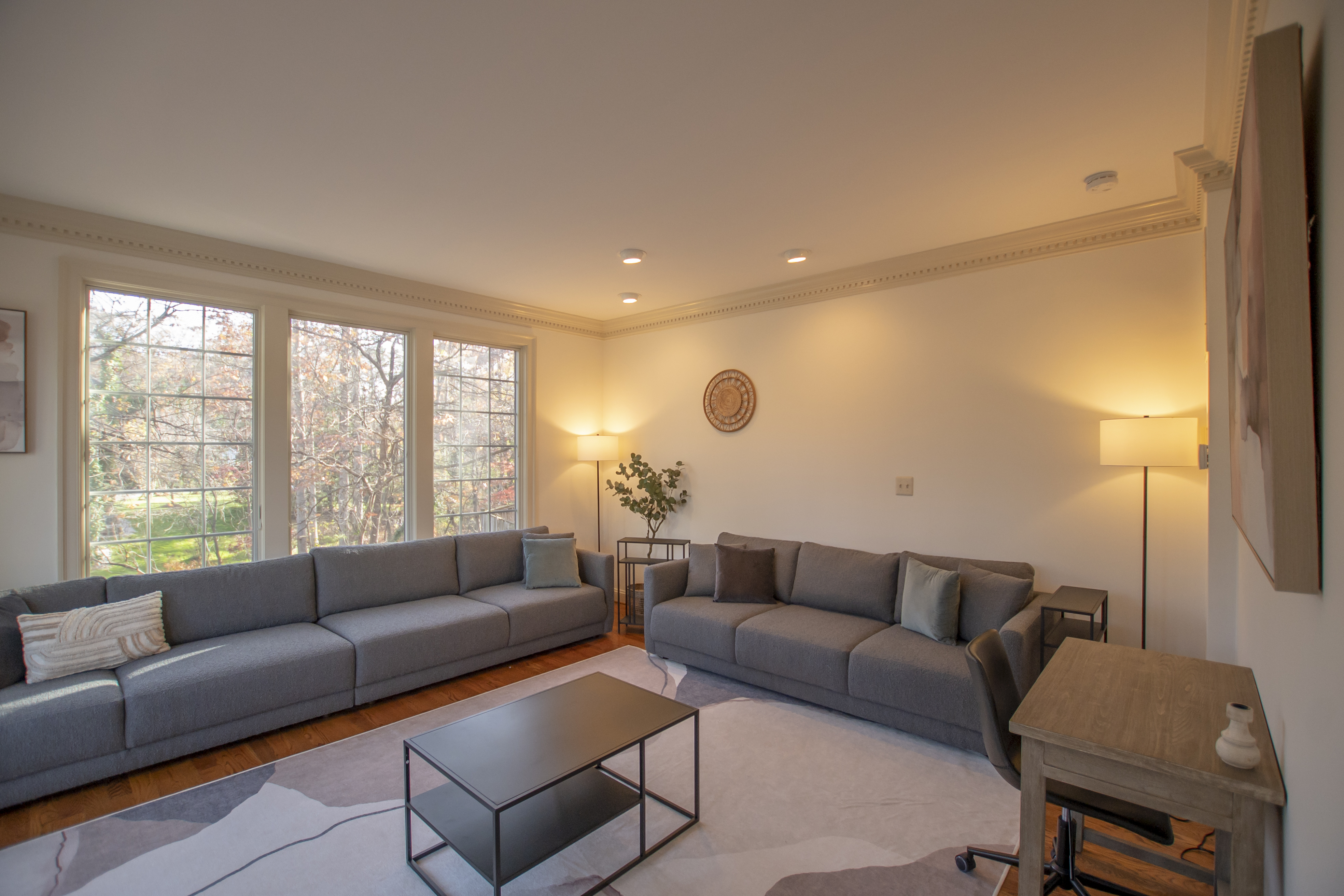 Spacious therapy lounge with modern gray seating.